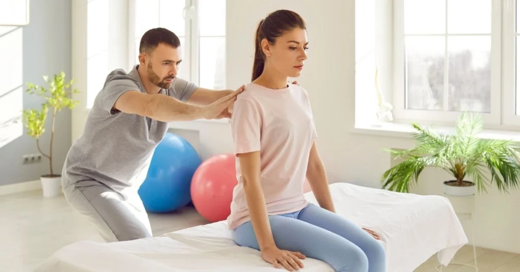 chiropractor-performing-back-alignment-technique-on-female-patient-in-clinic-setting