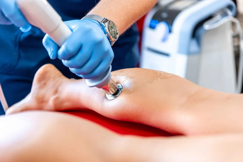 a person getting shockwave therapy for sports injury